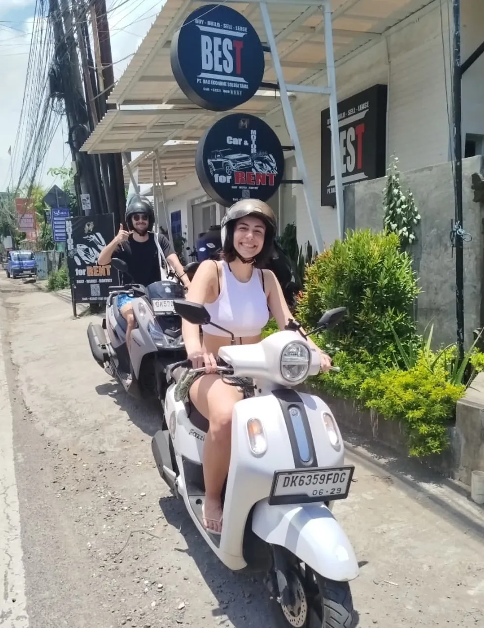 Group photo of customers with SMS Rental Bali signage
